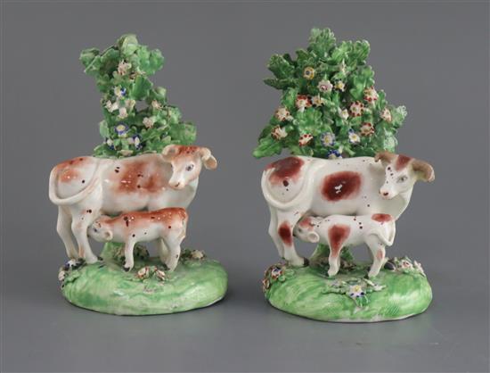 Two similar Derby groups of a cow and calf, c.1820-40, H. 14.5 - 15cm